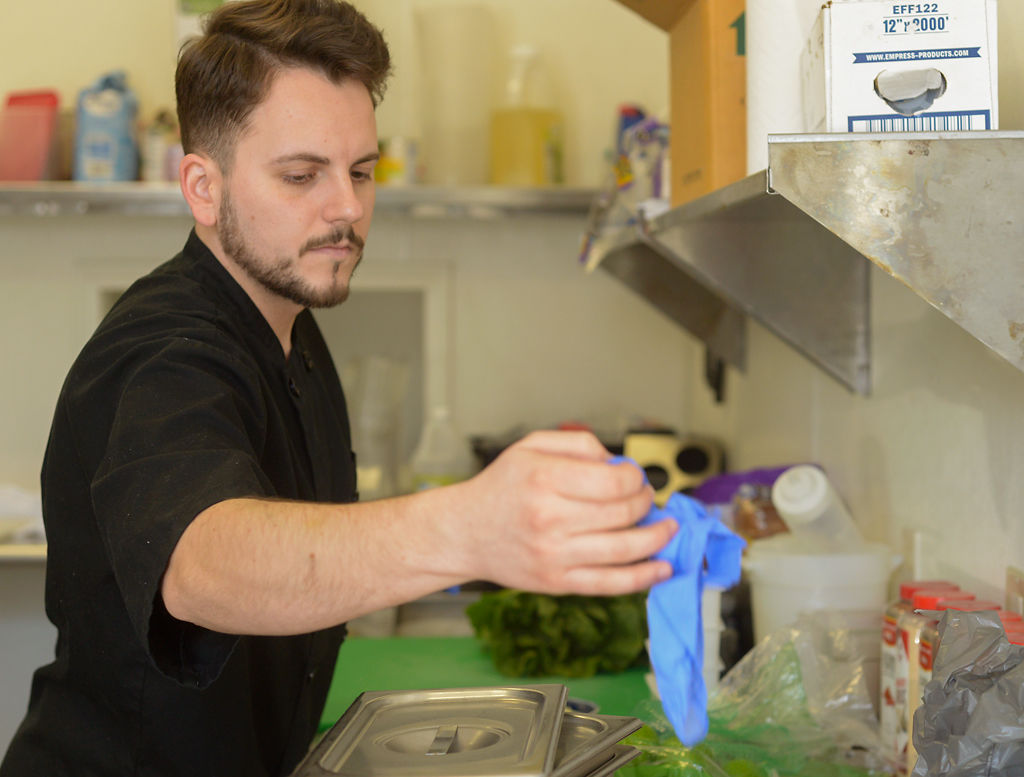 Colin Enslin prepares free to-go meals for the community